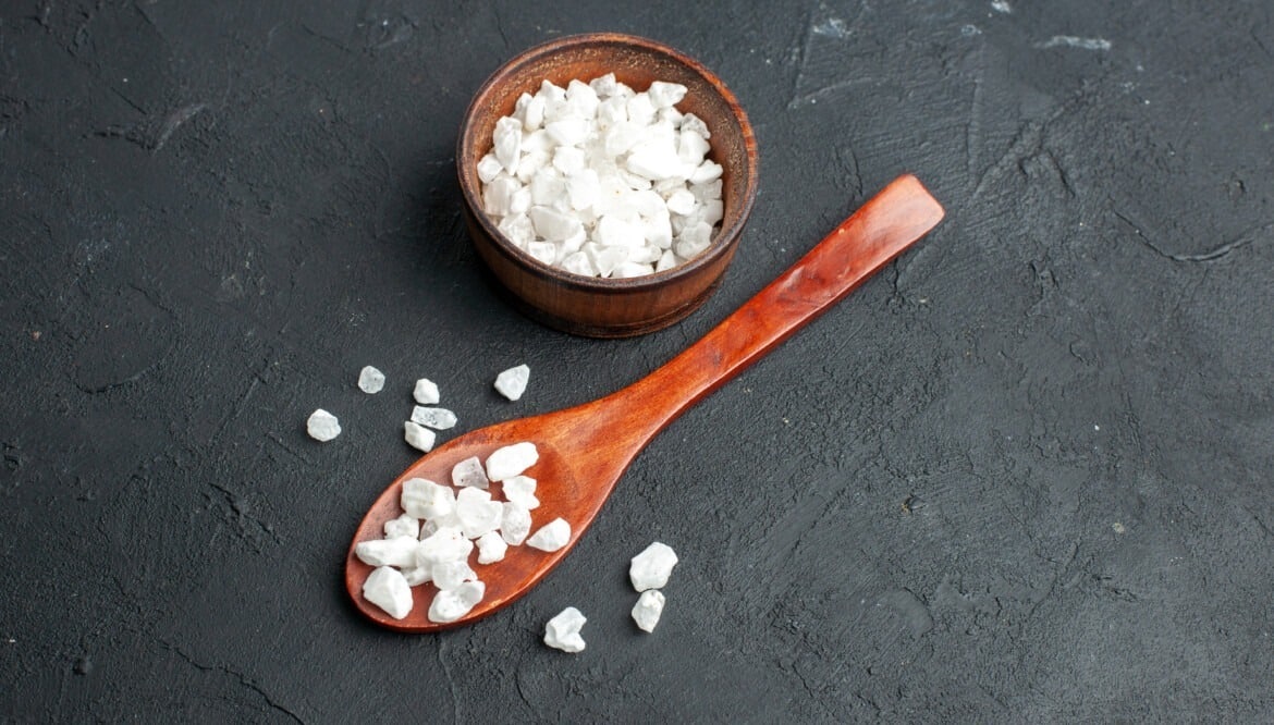 bottomviewseasaltbowlwoodenspoondarksurfacefreespace Athens Food Steps Athens Food Steps bottom view sea salt bowl wooden spoon dark surface free space